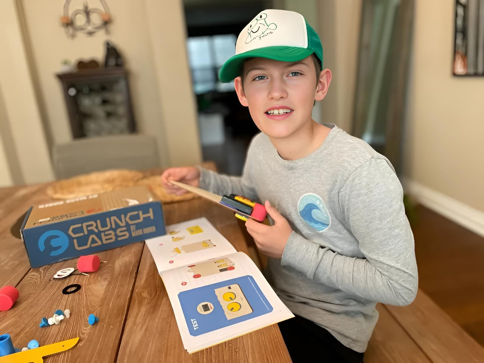 Photo of Boy Assembling a Build Box