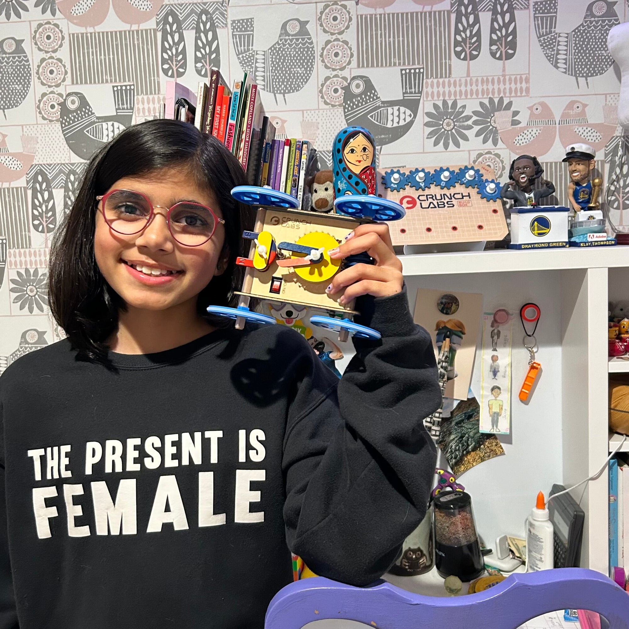 Photo of Girl Holding Up a Completed Build Box