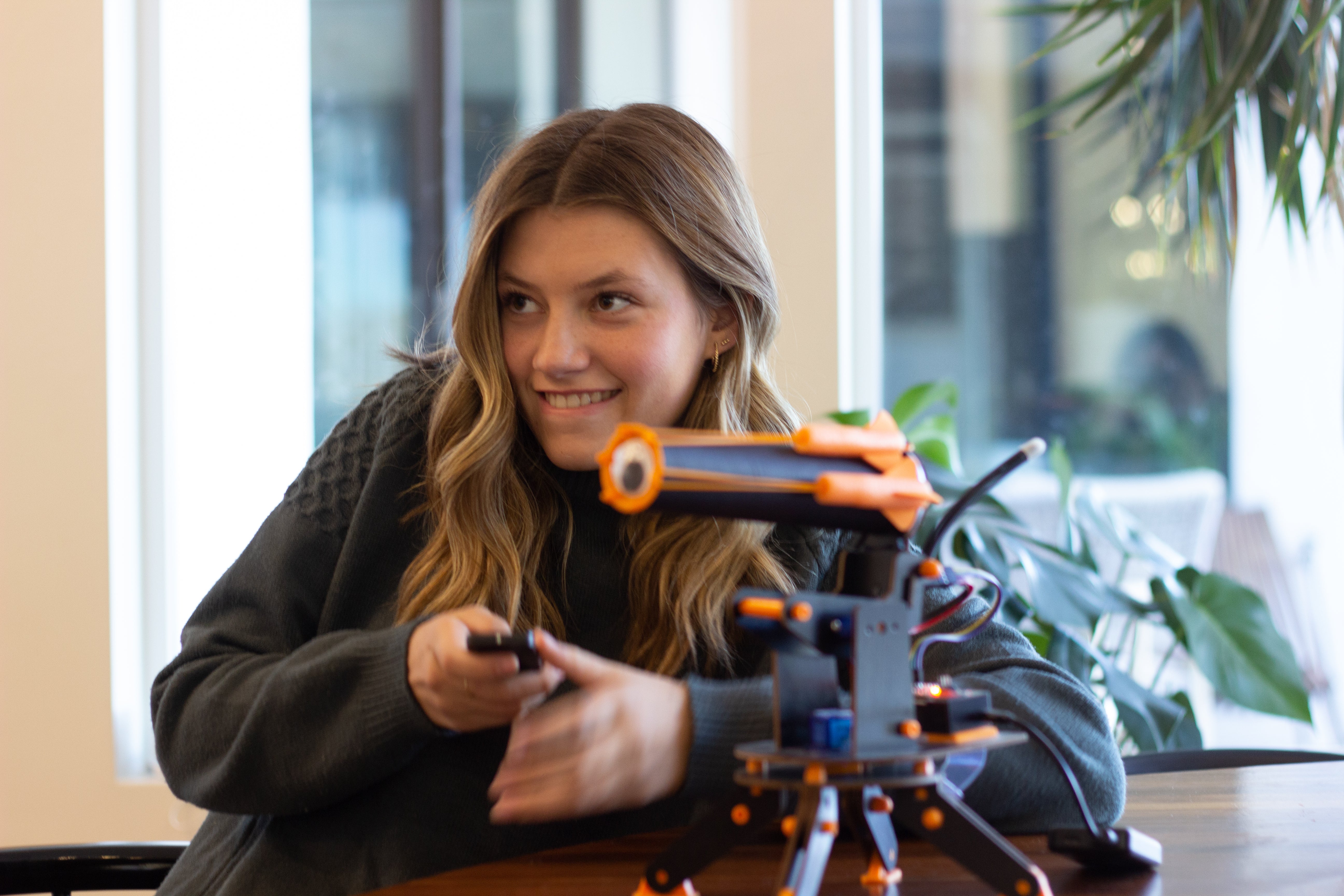 Photo of a Teen Girl Assembling an IR Turret